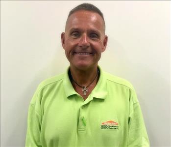 Male employee Bob Morrison wearing a lime green SERVPRO shirt