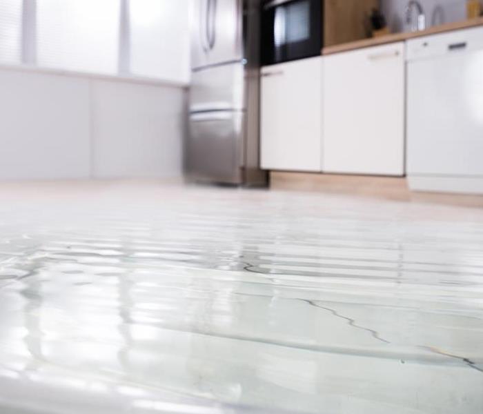 water damage all over a kitchen floor